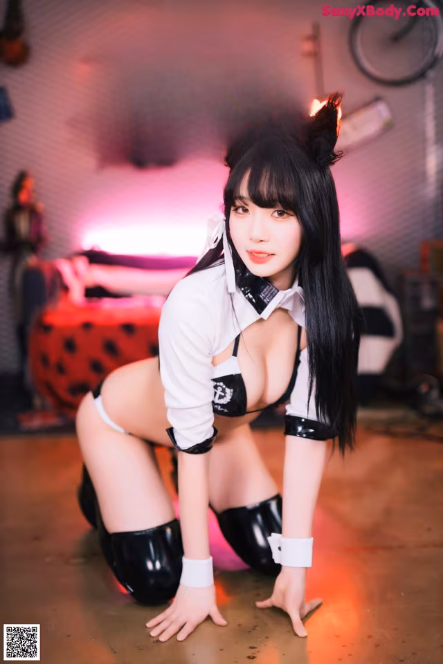 A woman in a cat costume posing for a picture.